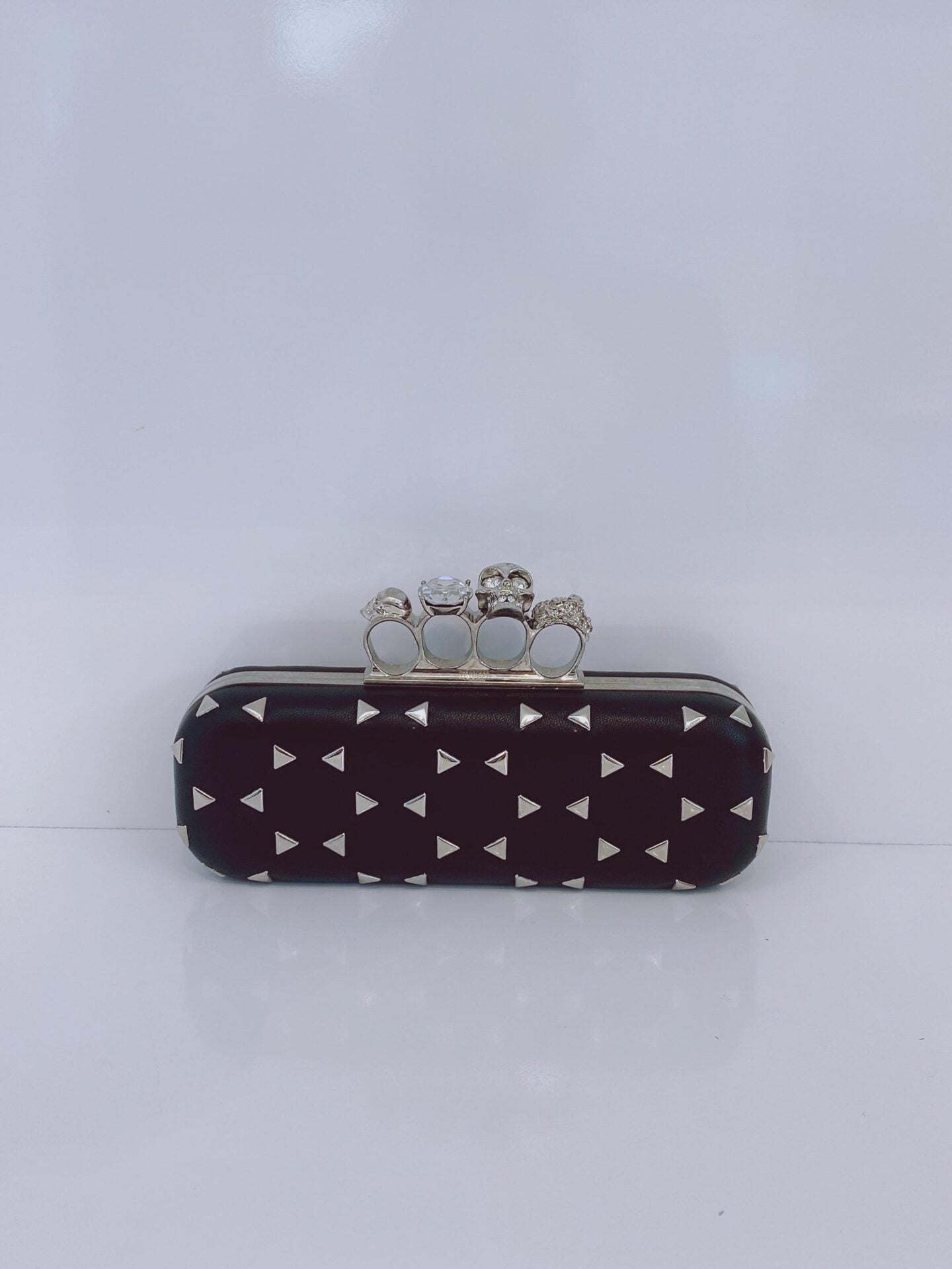 BLACK NAPPA TRIANGLE STUDDED KNUCKLE CLUTCH