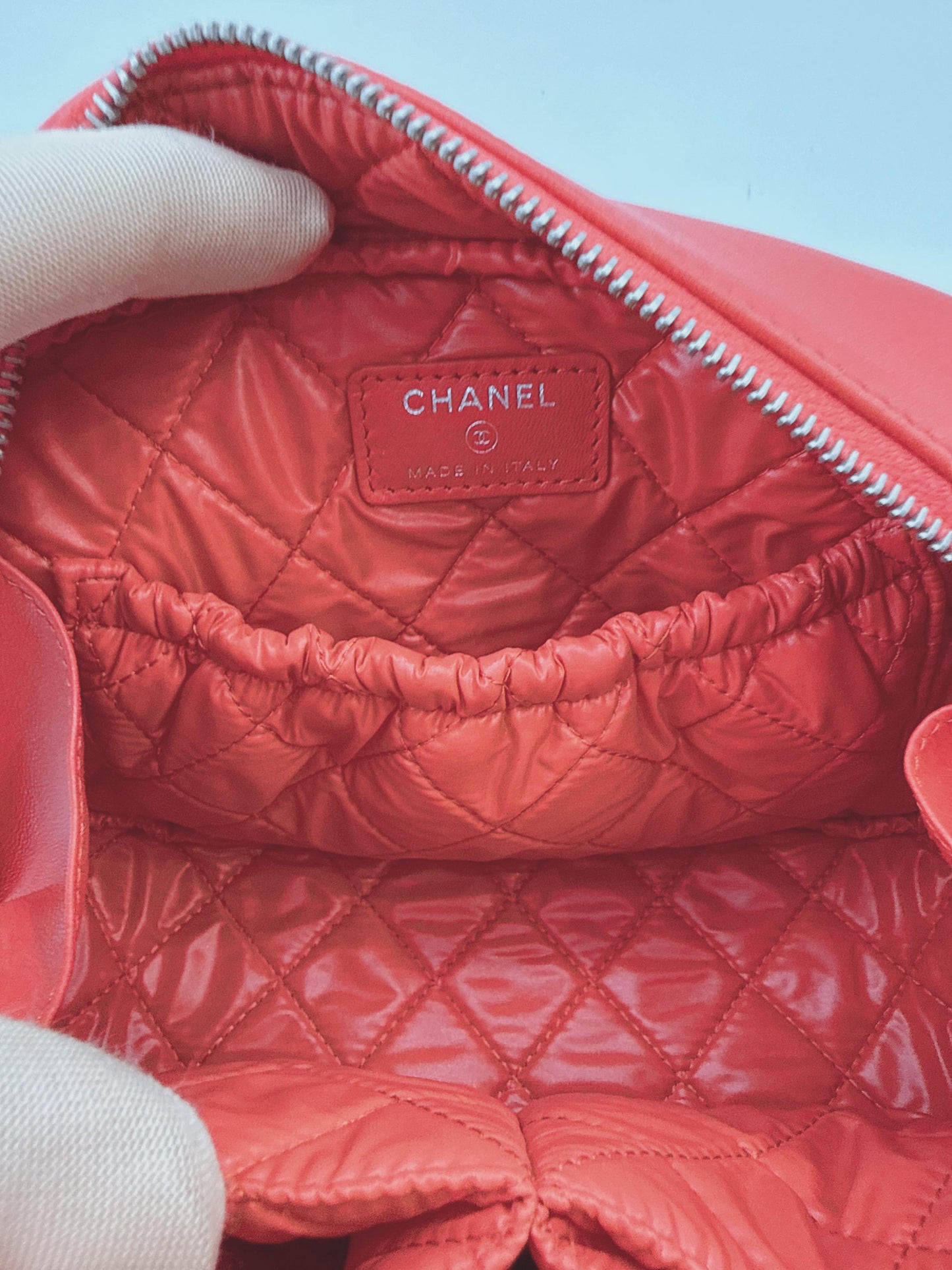 CORAL QUILTED LAMBSKIN LEATHER CURVY POUCH COSMETIC CASE