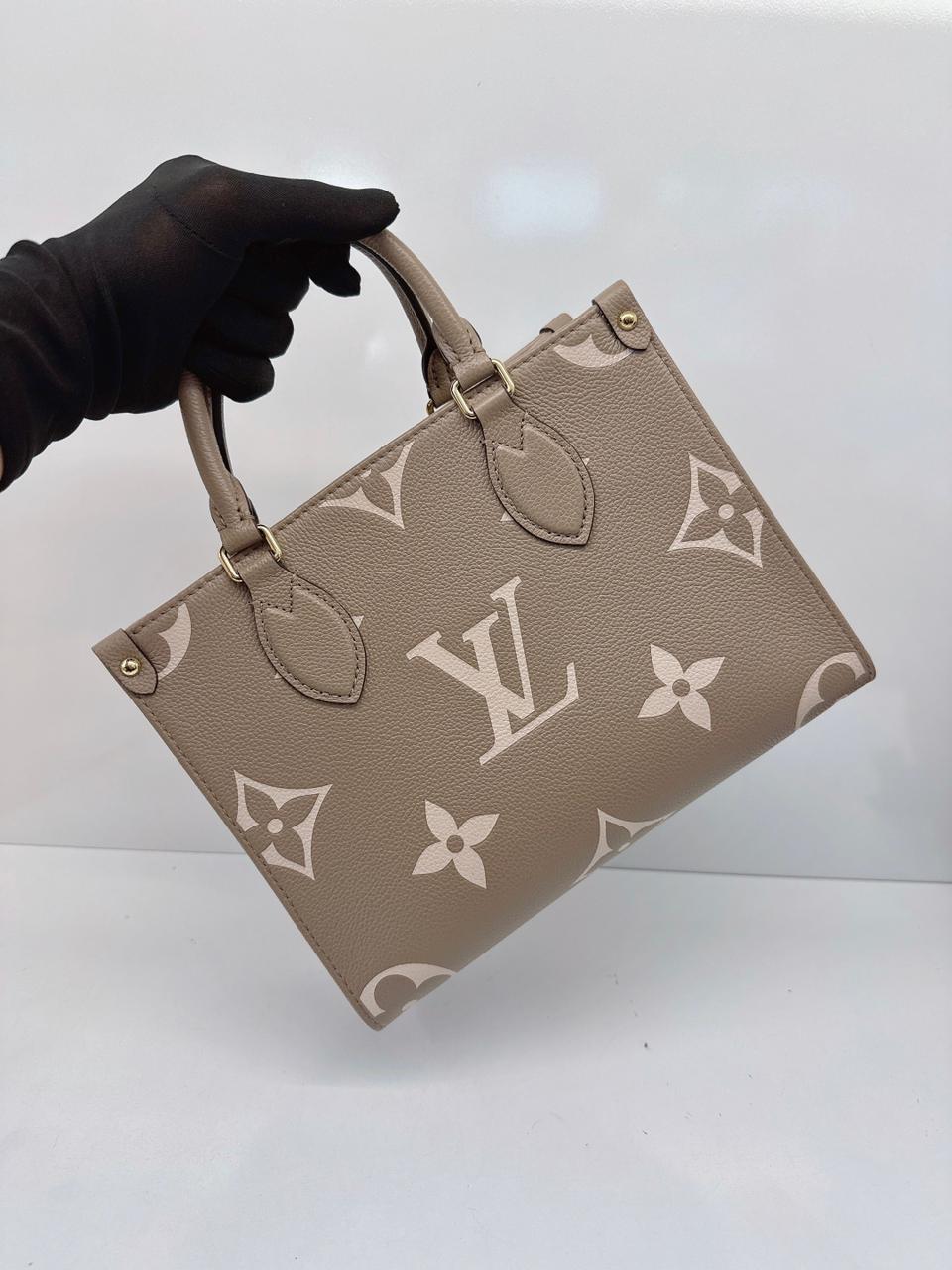 TOURTERELLE CRÈME BICOLOR MONOGRAM EMPREINTE LEATHER ONTHEGO PM TOTE BAG