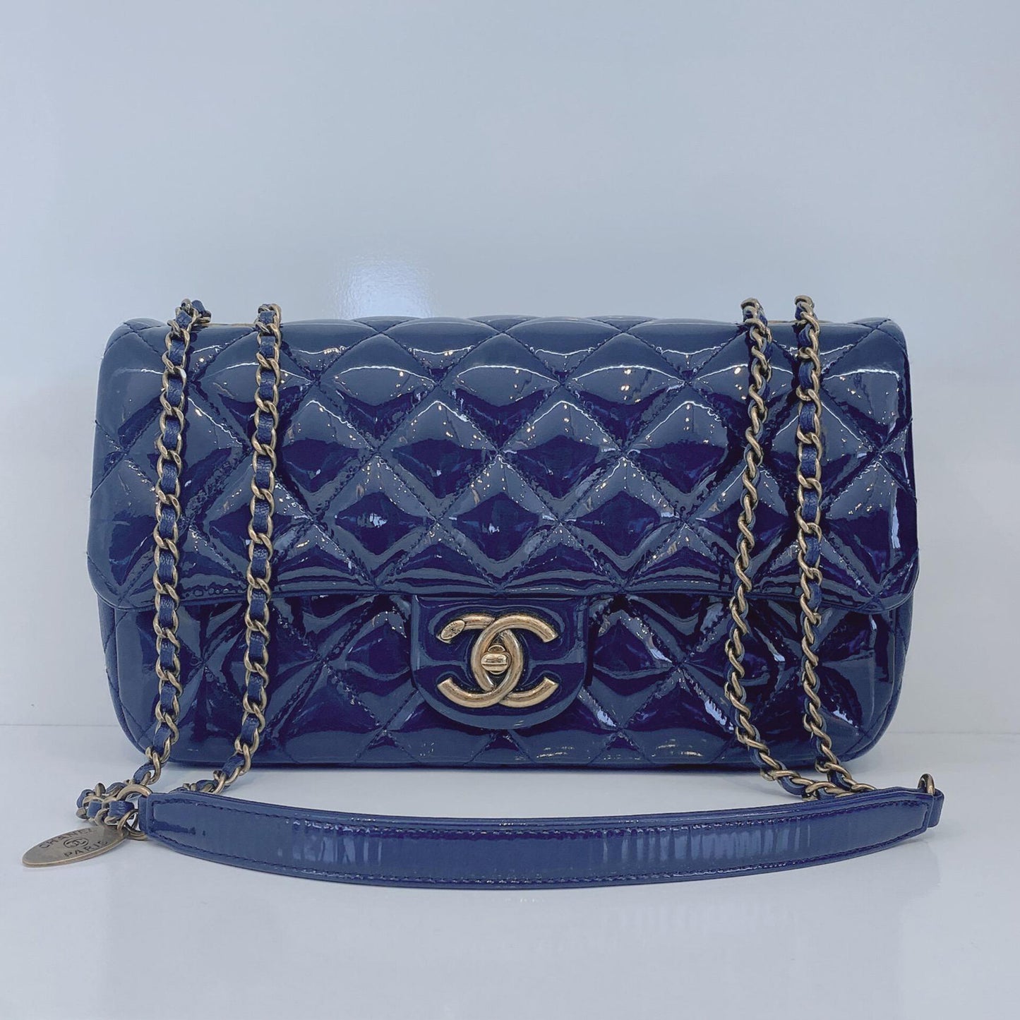 CHANEL BLUE PATENT GOATSKIN QUILTED SMALL CC EYELET FLAP BAG