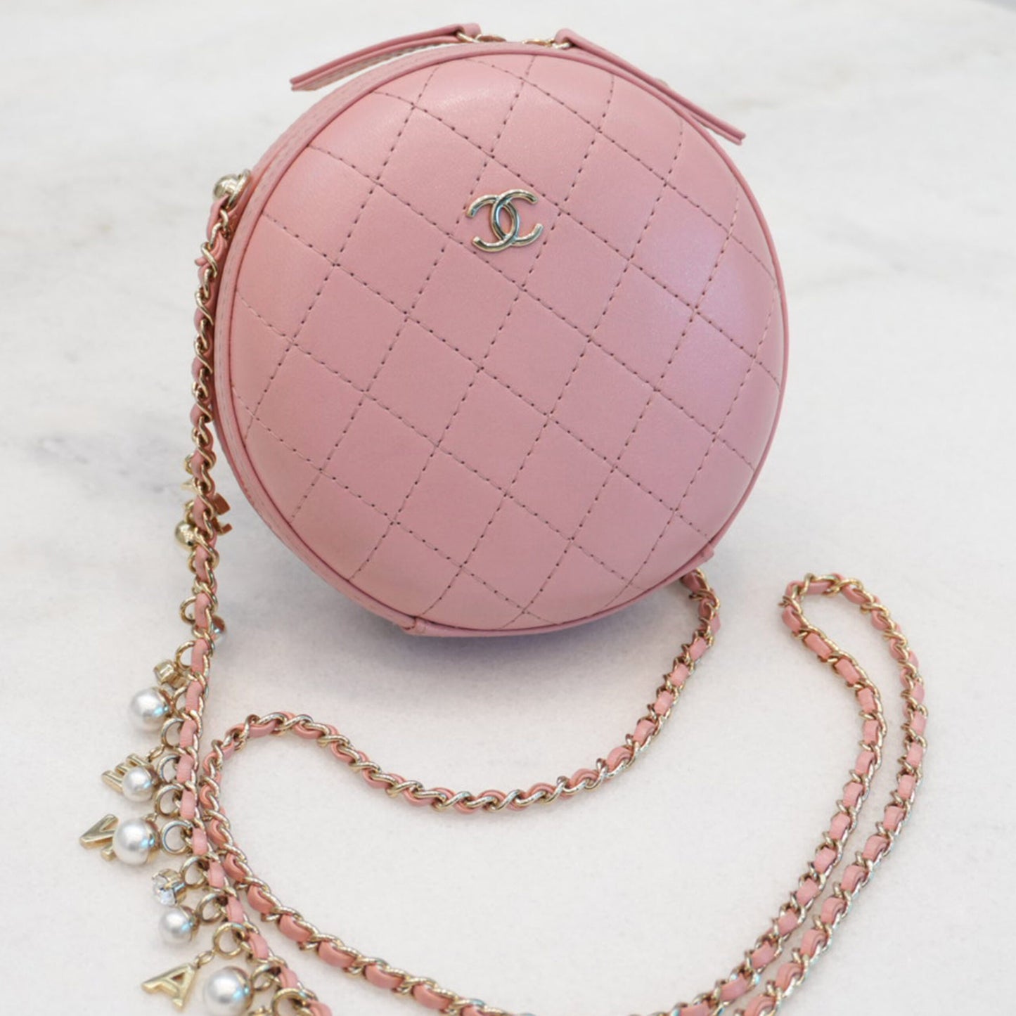 CC QUILTED LAMBSKIN ROUND CROSSBODY BAG