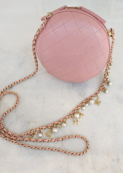 CC QUILTED LAMBSKIN ROUND CROSSBODY BAG