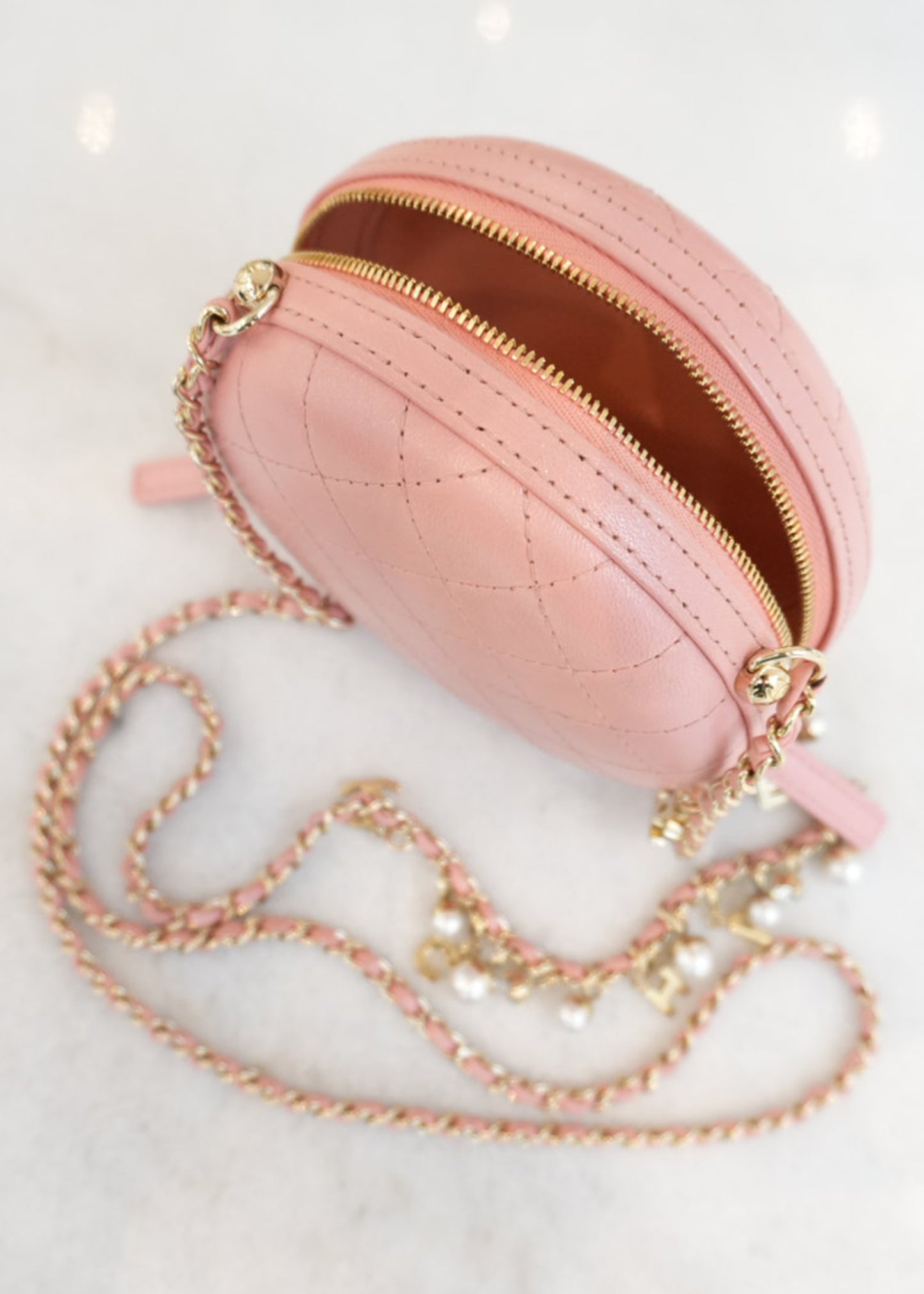 CC QUILTED LAMBSKIN ROUND CROSSBODY BAG