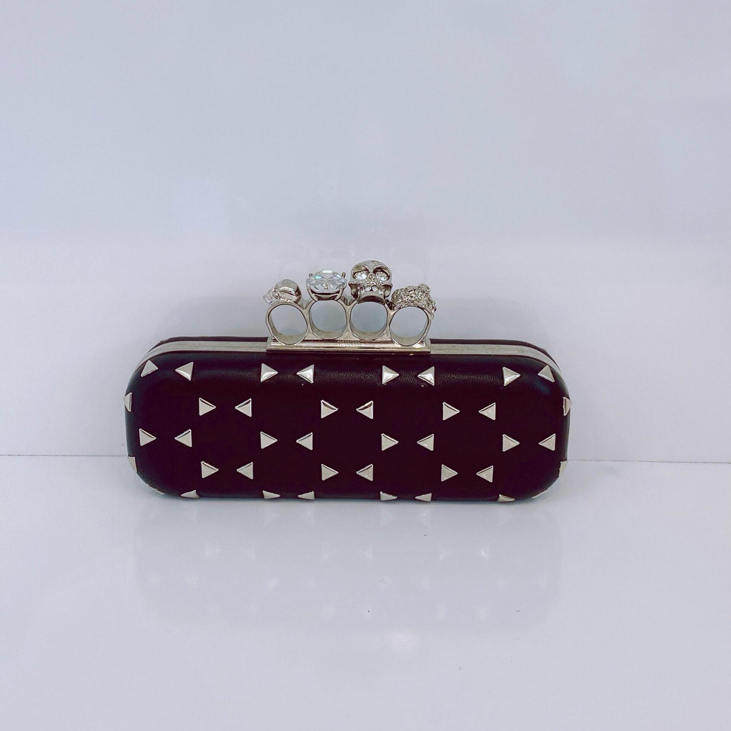 BLACK NAPPA TRIANGLE STUDDED KNUCKLE CLUTCH