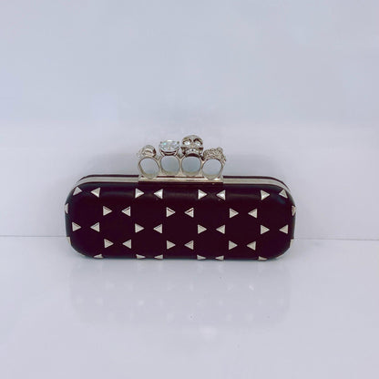 BLACK NAPPA TRIANGLE STUDDED KNUCKLE CLUTCH