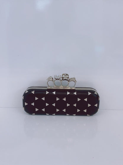 BLACK NAPPA TRIANGLE STUDDED KNUCKLE CLUTCH