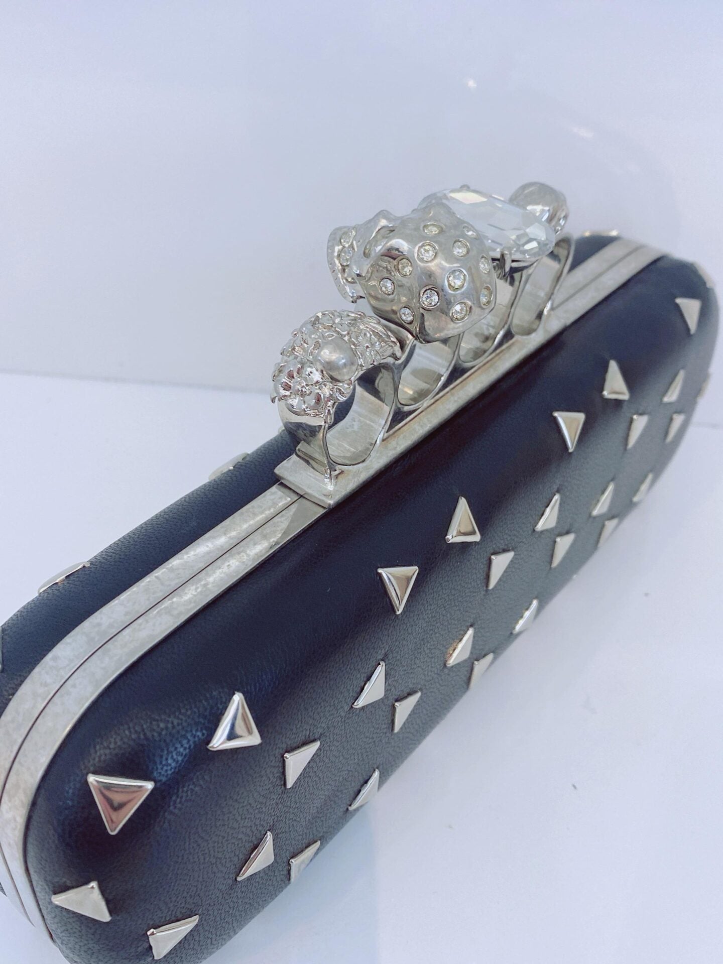 BLACK NAPPA TRIANGLE STUDDED KNUCKLE CLUTCH
