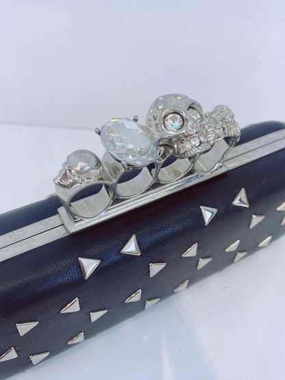 BLACK NAPPA TRIANGLE STUDDED KNUCKLE CLUTCH