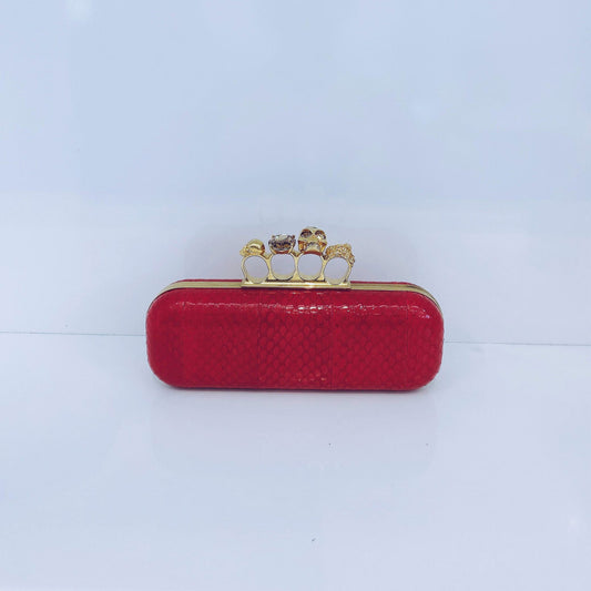 RED PYTHON SKIN KNUCKLE CLUTCH WITH CRYSTAL AND GOLD TONE HARDWARE