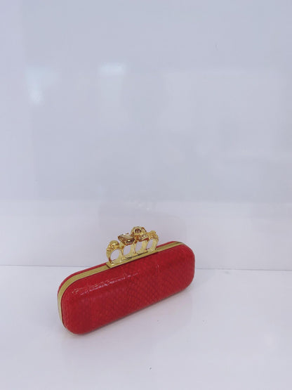 RED PYTHON SKIN KNUCKLE CLUTCH WITH CRYSTAL AND GOLD TONE HARDWARE