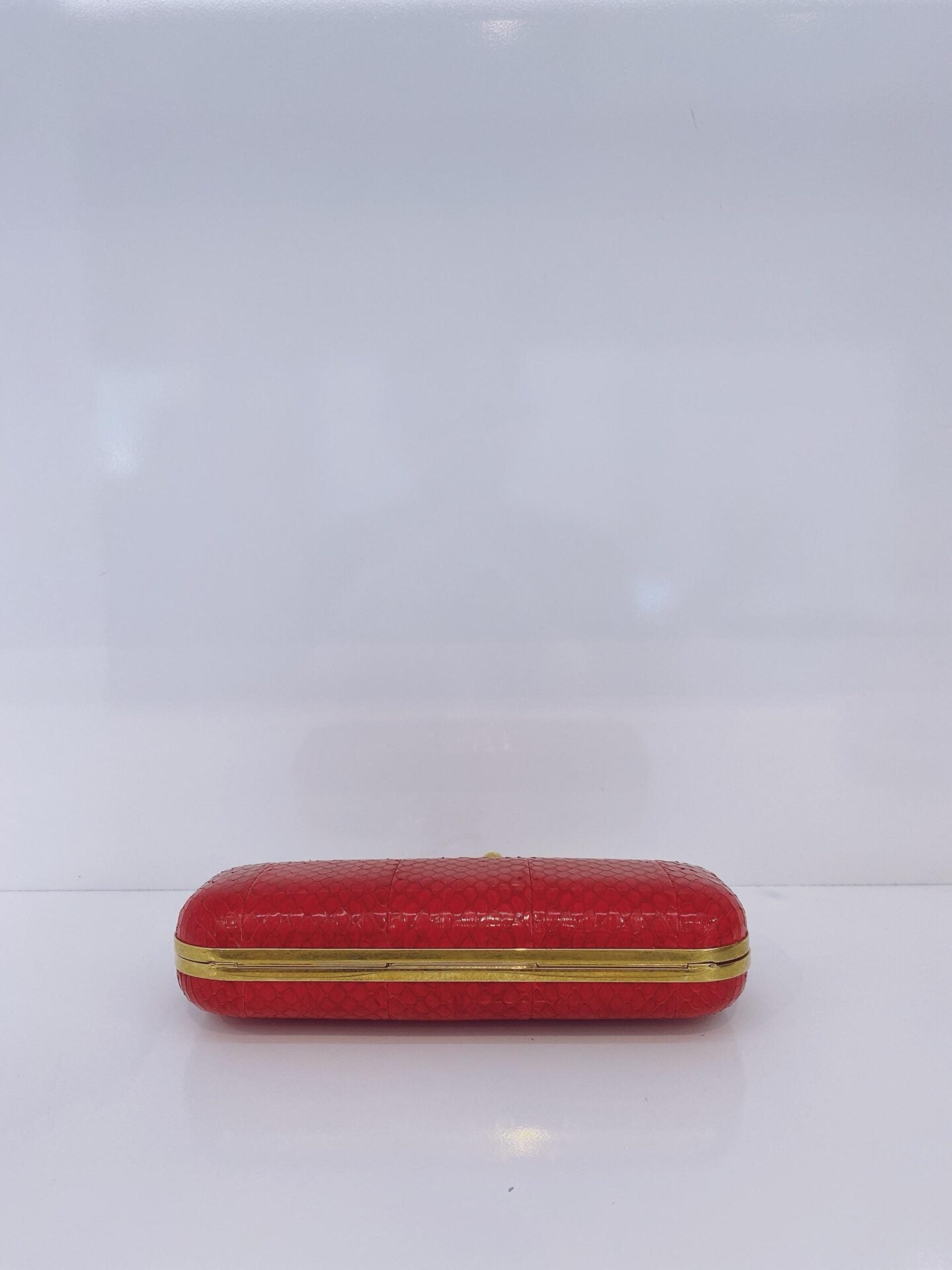 RED PYTHON SKIN KNUCKLE CLUTCH WITH CRYSTAL AND GOLD TONE HARDWARE