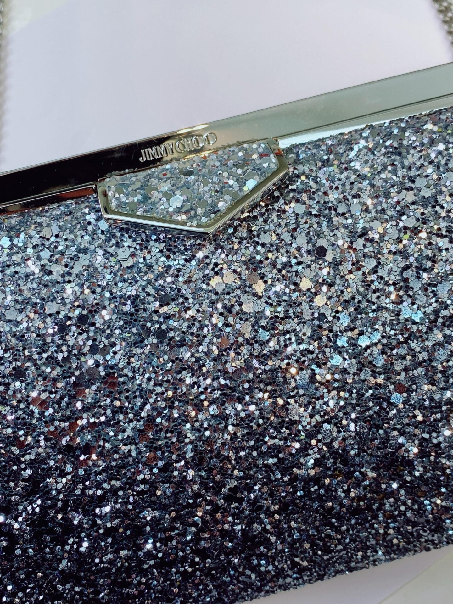 COARSE GLITTER ELLIPSE CHAIN CLUTCH