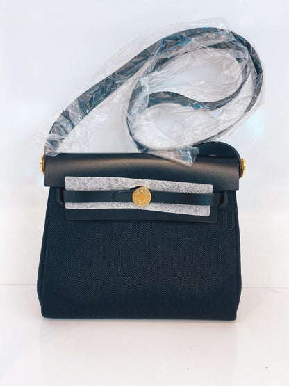 HERBAG ZIP 20 MINI BLACK TOILE MILITAIRE CANVAS AND BLACK VACHE HUNTER GOLD HARDWARE