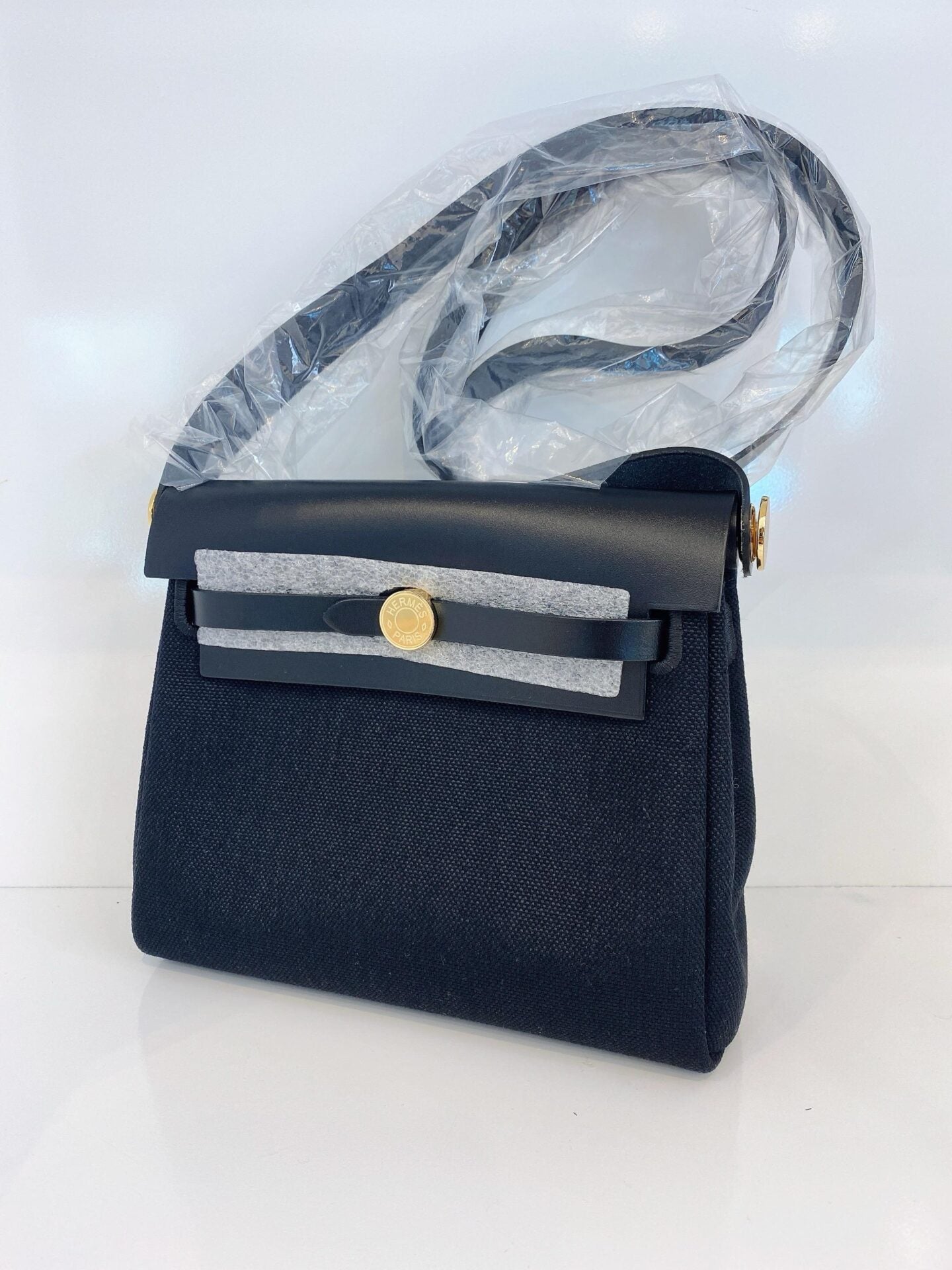 HERBAG ZIP 20 MINI BLACK TOILE MILITAIRE CANVAS AND BLACK VACHE HUNTER GOLD HARDWARE