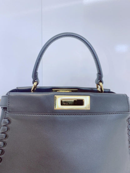BLACK LEATHER MEDIUM WHIPSTITCHED PEEKABOO TOP HANDLE BAG