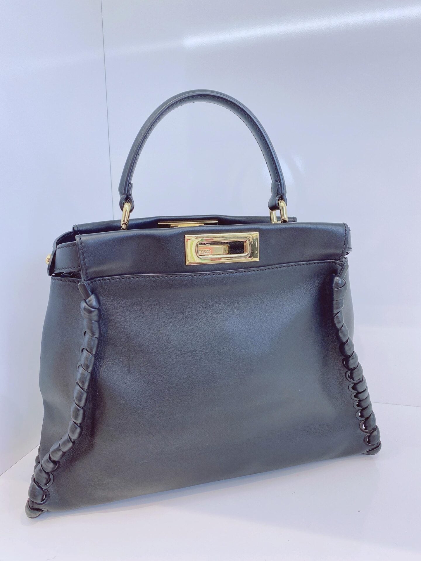 BLACK LEATHER MEDIUM WHIPSTITCHED PEEKABOO TOP HANDLE BAG