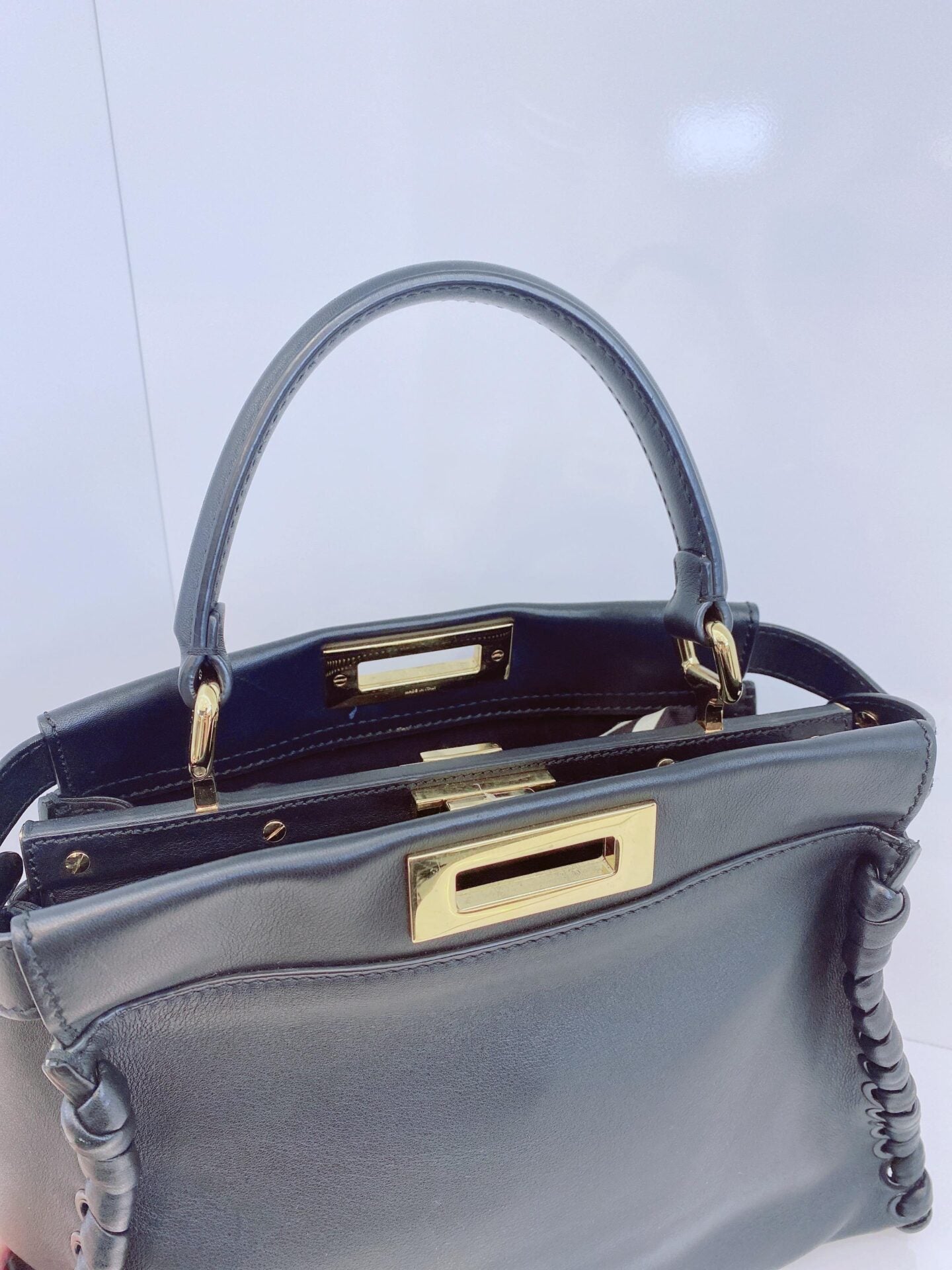 BLACK LEATHER MEDIUM WHIPSTITCHED PEEKABOO TOP HANDLE BAG
