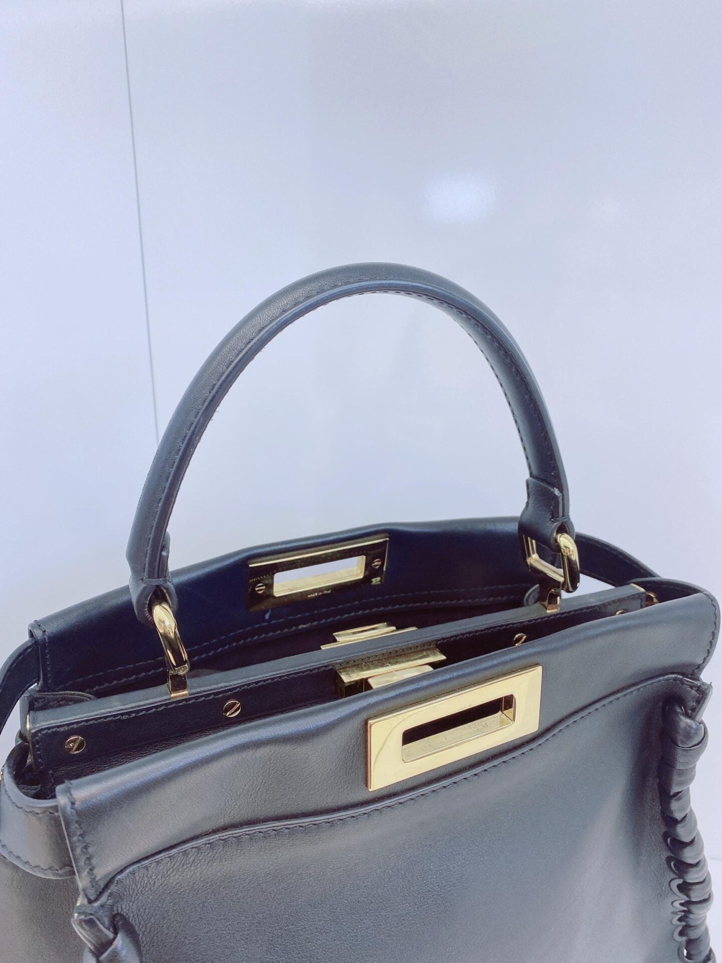 BLACK LEATHER MEDIUM WHIPSTITCHED PEEKABOO TOP HANDLE BAG