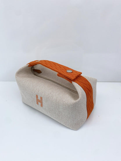 BEIGE ORANGE BRIDE-A-BRAC POUCH, SMALL MODEL