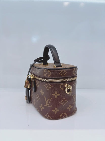 MONOGRAM REVERSE CANVAS VANITY PM  BAG