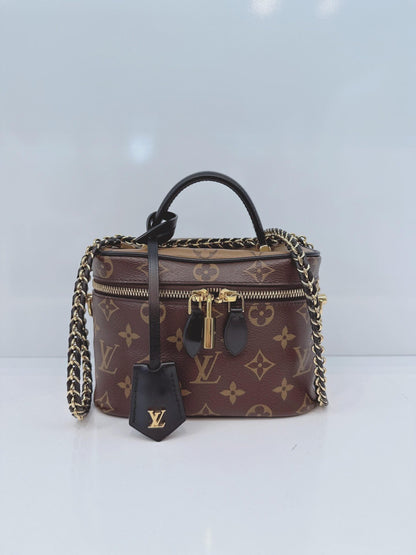 MONOGRAM REVERSE CANVAS VANITY PM  BAG