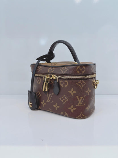 MONOGRAM REVERSE CANVAS VANITY PM  BAG