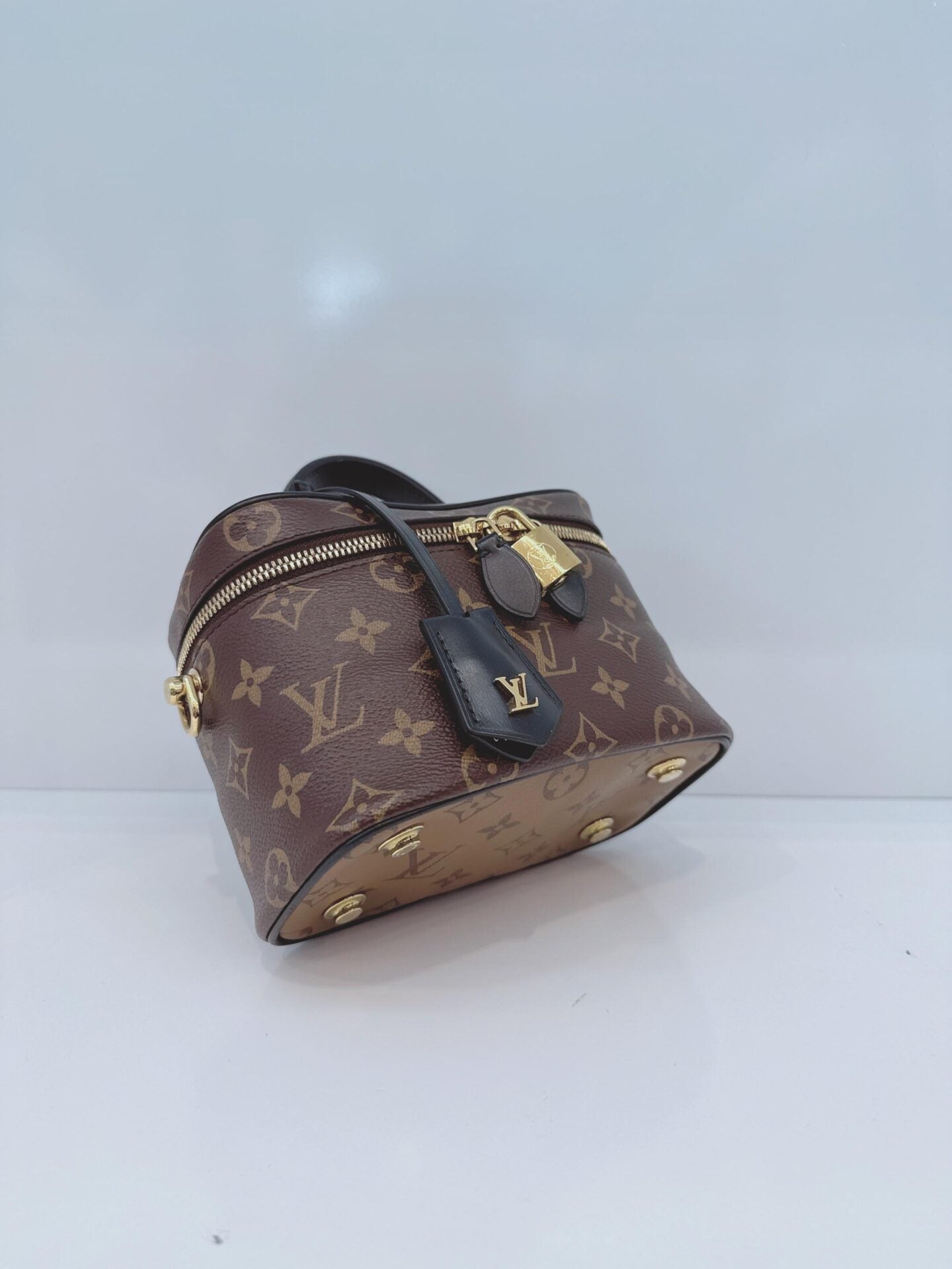 MONOGRAM REVERSE CANVAS VANITY PM  BAG
