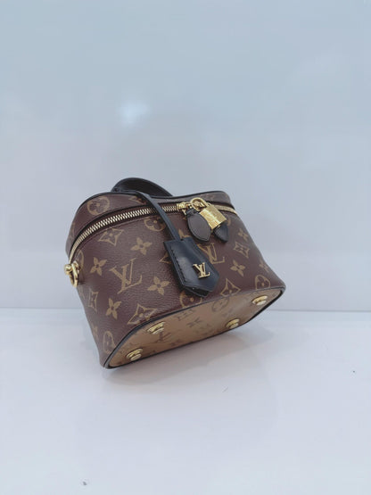 MONOGRAM REVERSE CANVAS VANITY PM  BAG