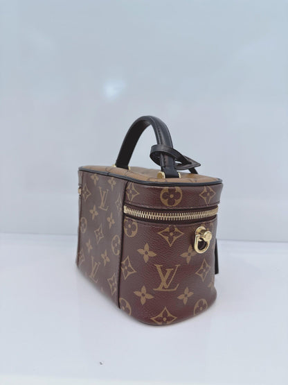 MONOGRAM REVERSE CANVAS VANITY PM  BAG