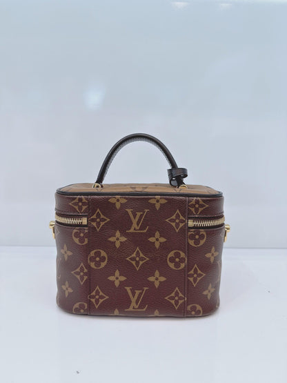 MONOGRAM REVERSE CANVAS VANITY PM  BAG