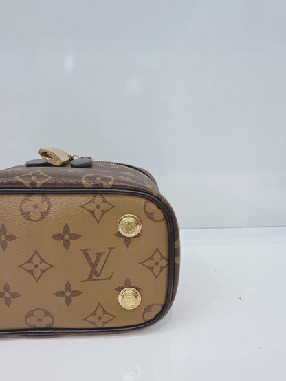 MONOGRAM REVERSE CANVAS VANITY PM  BAG