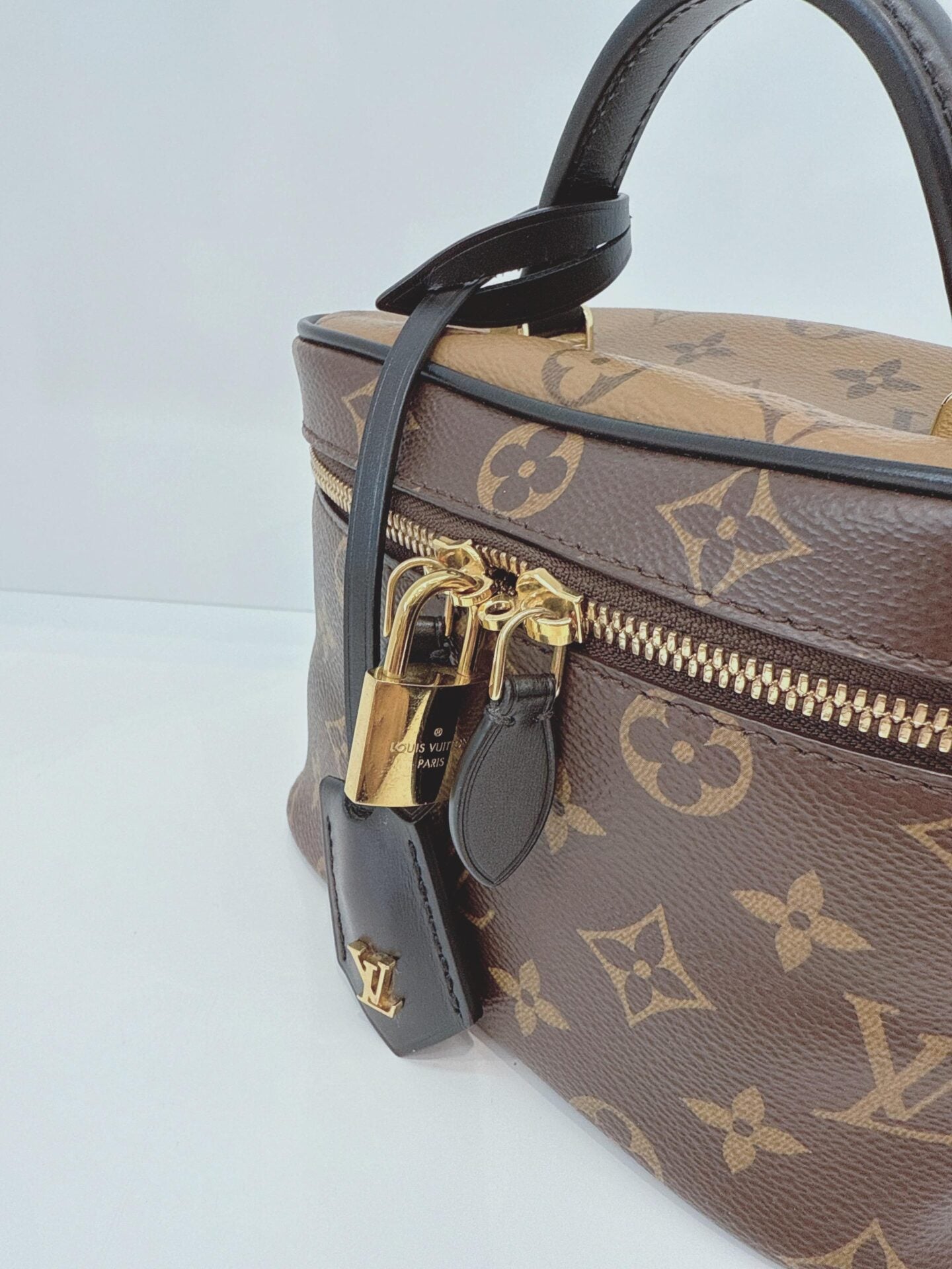 MONOGRAM REVERSE CANVAS VANITY PM  BAG