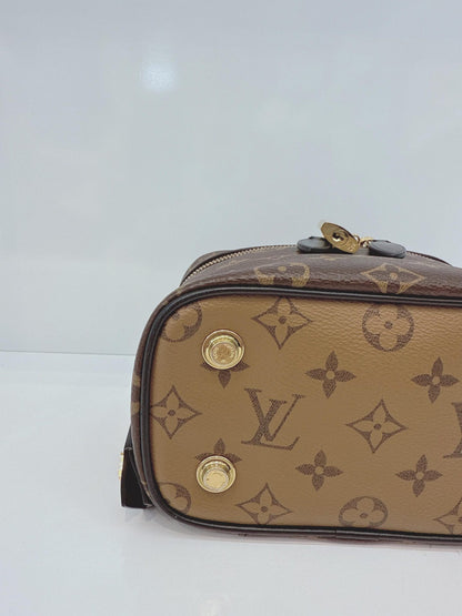 MONOGRAM REVERSE CANVAS VANITY PM  BAG