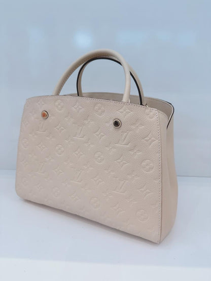 WHITE MONOGRAM EMPREINTE LEATHER MONTAIGNE MM BAG