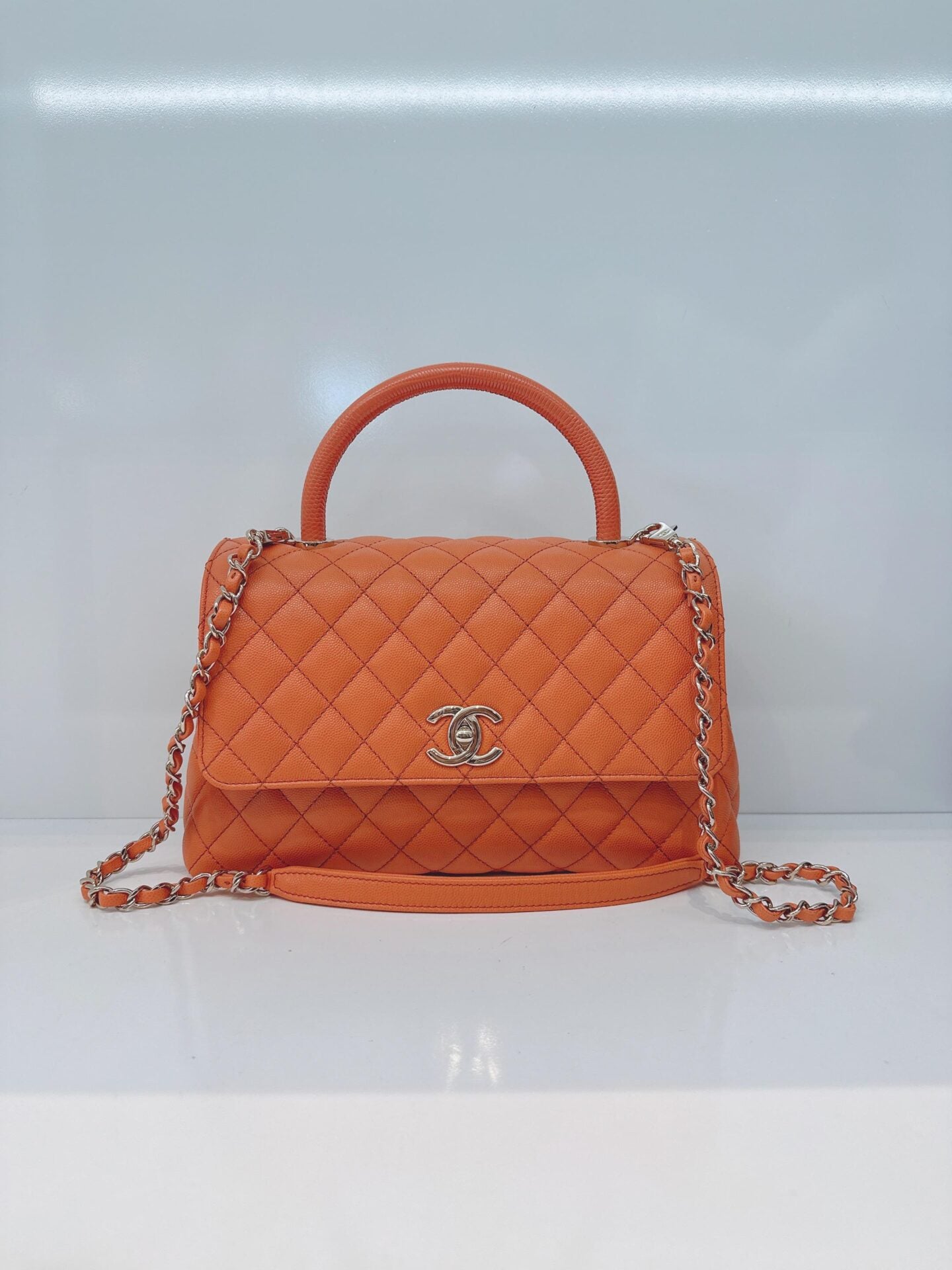 ORANGE QUILTED CAVIAR LEATHER MEDIUM COCO TOP HANDLE BAG
