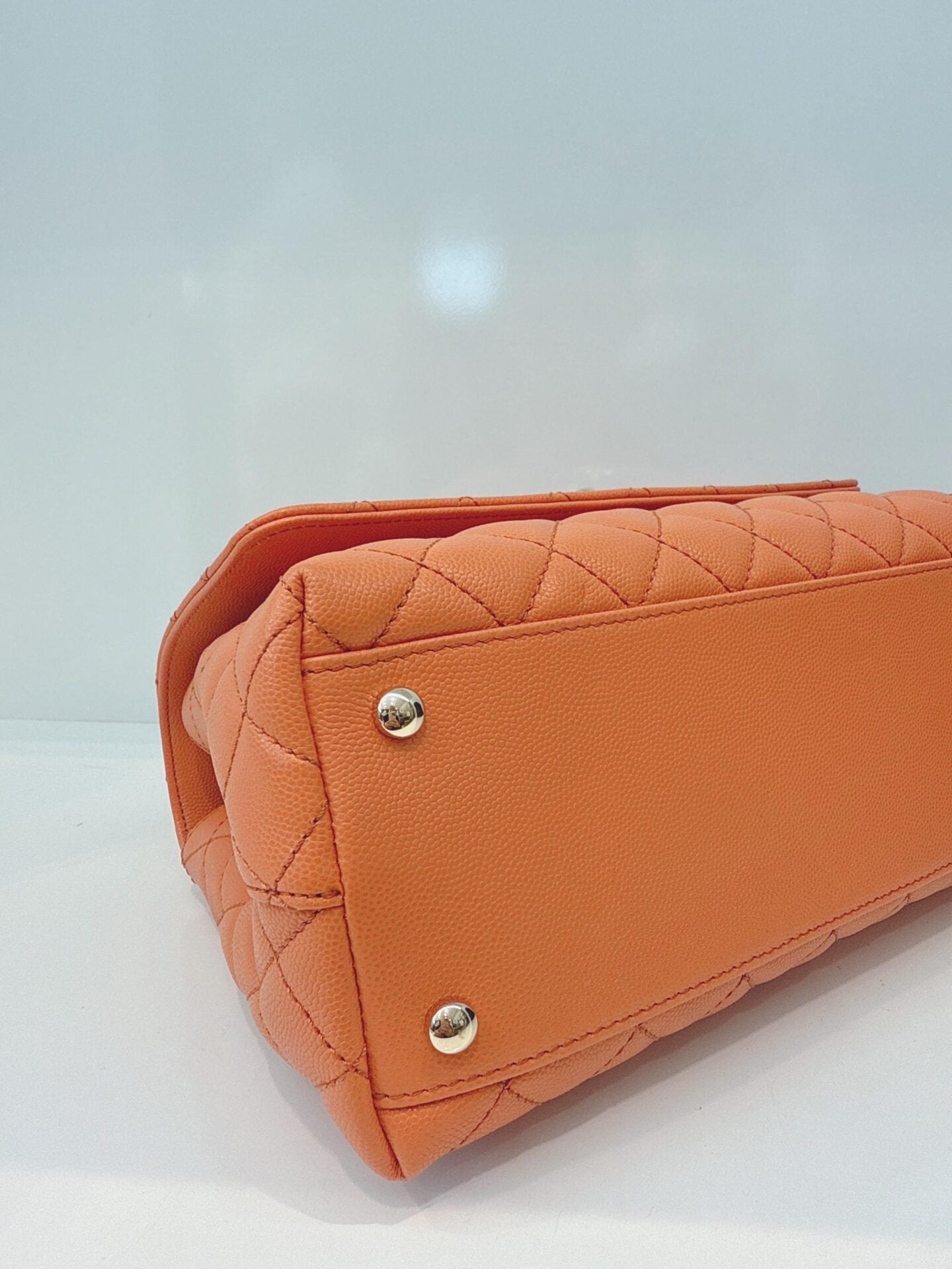 ORANGE QUILTED CAVIAR LEATHER MEDIUM COCO TOP HANDLE BAG