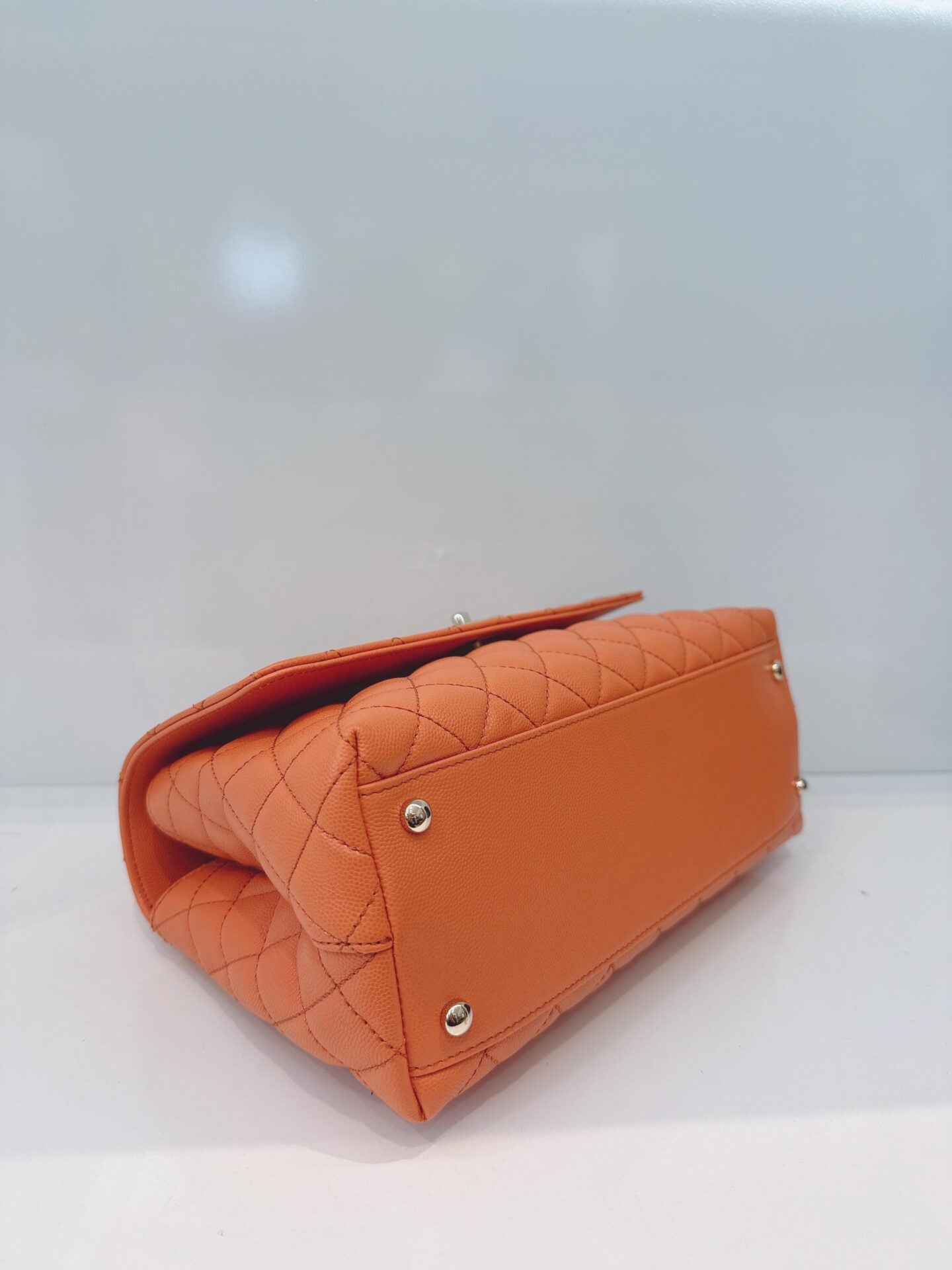 ORANGE QUILTED CAVIAR LEATHER MEDIUM COCO TOP HANDLE BAG