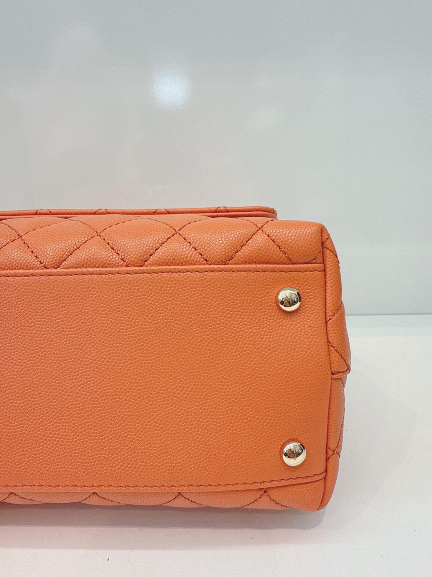 ORANGE QUILTED CAVIAR LEATHER MEDIUM COCO TOP HANDLE BAG