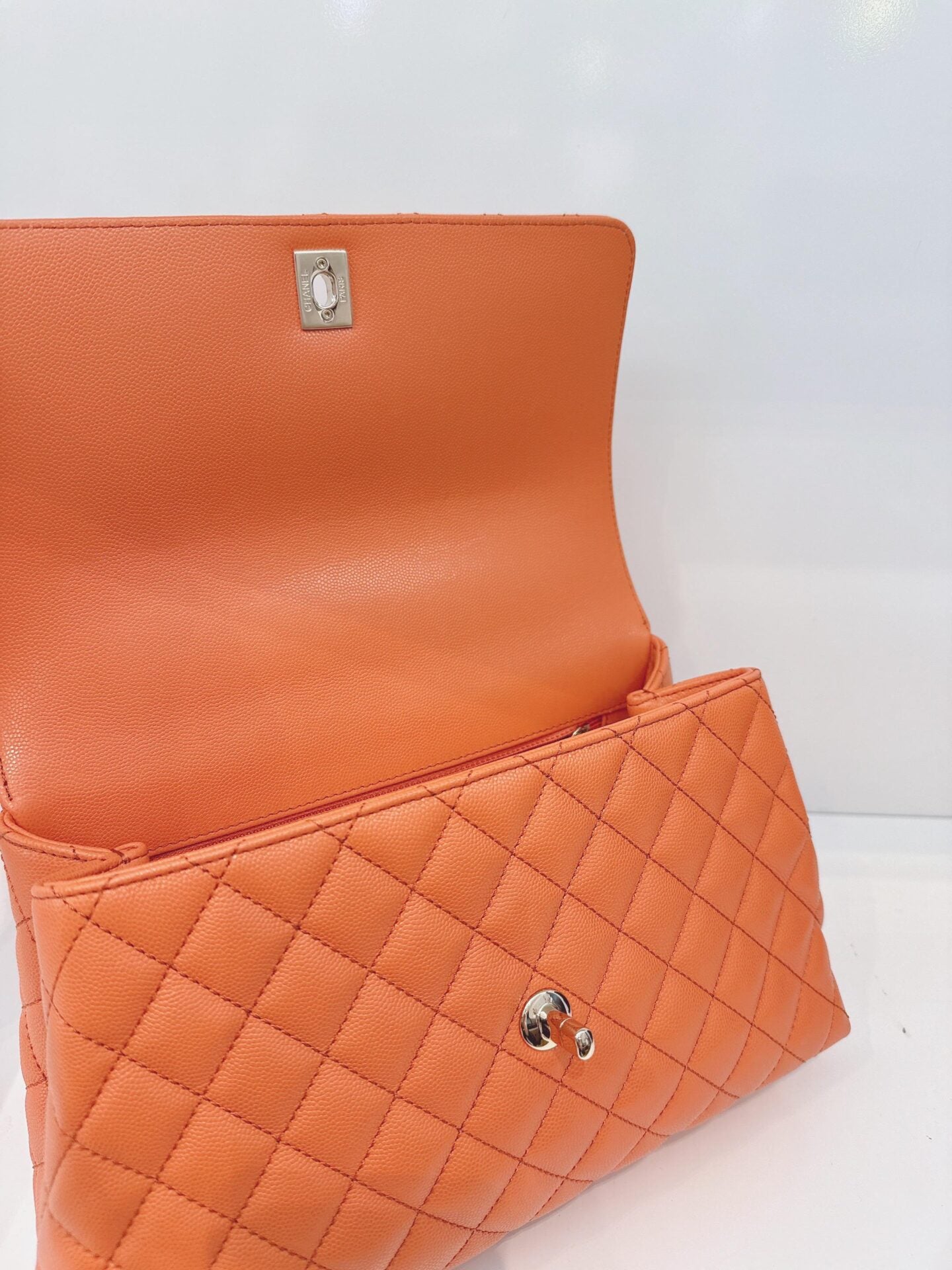 ORANGE QUILTED CAVIAR LEATHER MEDIUM COCO TOP HANDLE BAG