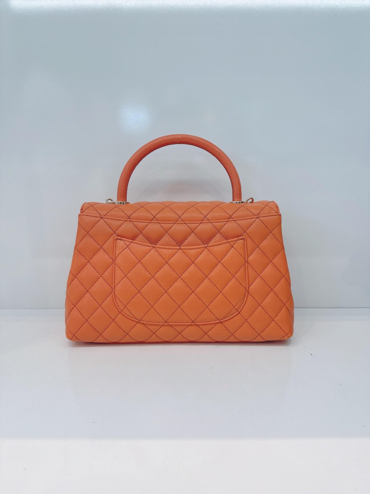 ORANGE QUILTED CAVIAR LEATHER MEDIUM COCO TOP HANDLE BAG