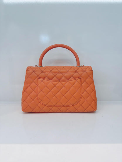 ORANGE QUILTED CAVIAR LEATHER MEDIUM COCO TOP HANDLE BAG