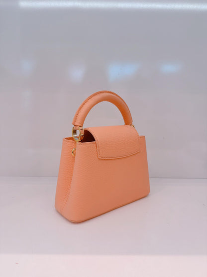 APRICOT TAURILLON LEATHER MINI CAPUCINES