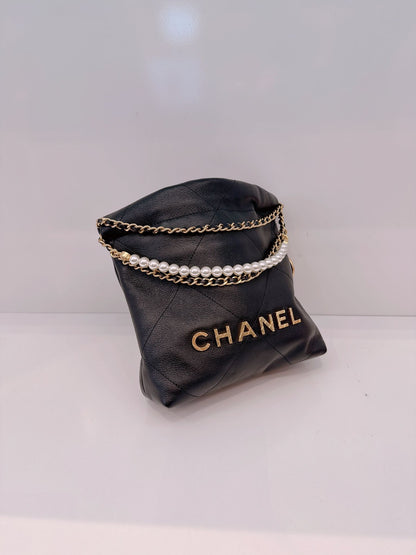 BLACK QUILTED LEATHER MINI CHANEL 22 CHAIN BAG