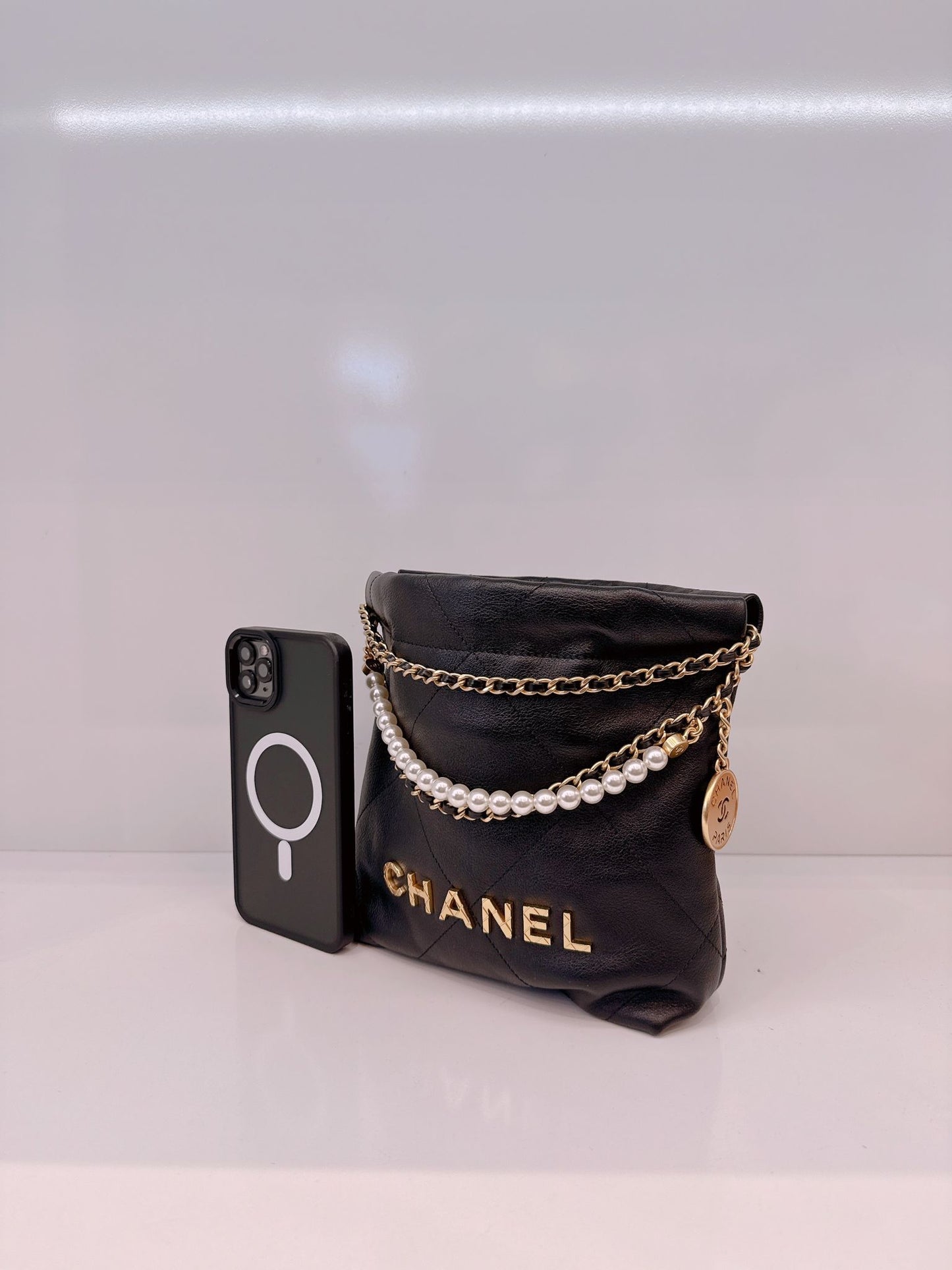 BLACK QUILTED LEATHER MINI CHANEL 22 CHAIN BAG