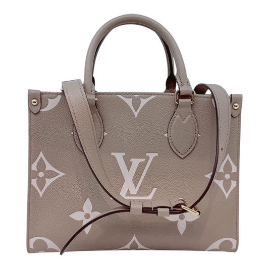 TOURTERELLE CRÈME BICOLOR MONOGRAM EMPREINTE LEATHER ONTHEGO PM TOTE BAG