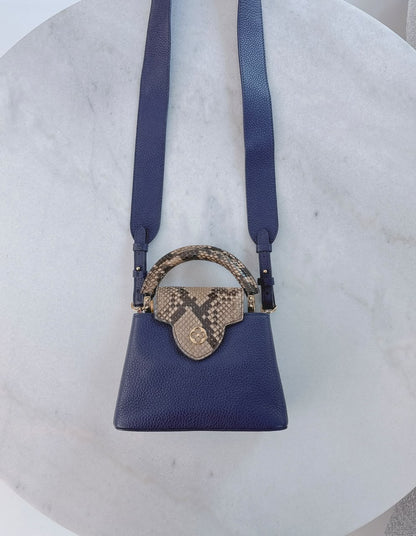 NAVY BLUE MINI CAPUCINES PYTHON TOP HANDLE BAG