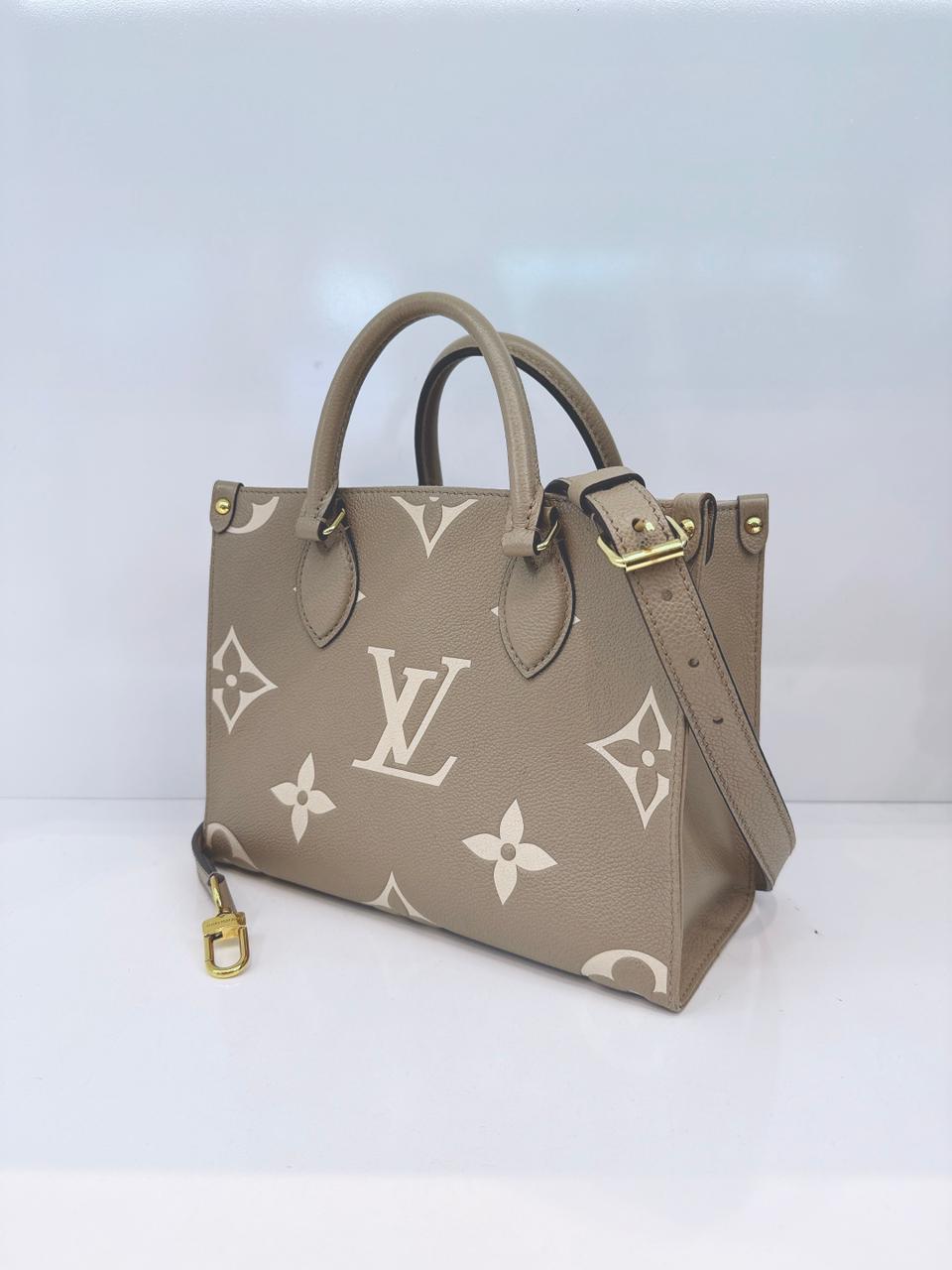 TOURTERELLE / CREAM MONOGRAM EMPREINTE LEATHER ONTHEGO PM HANDBAG