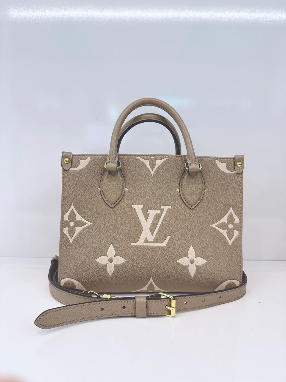 TOURTERELLE / CREAM MONOGRAM EMPREINTE LEATHER ONTHEGO PM HANDBAG