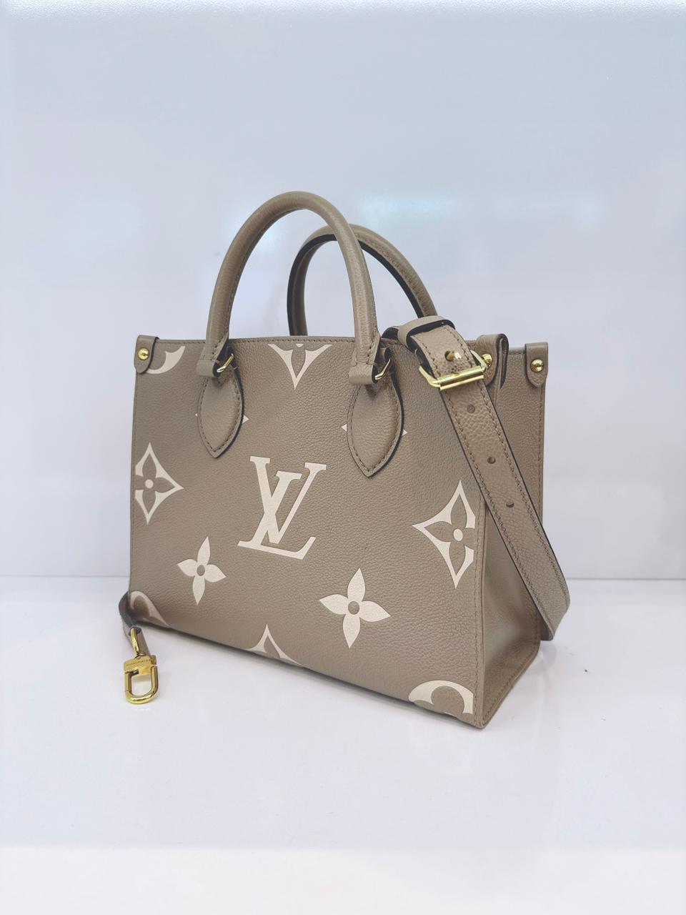 TOURTERELLE / CREAM MONOGRAM EMPREINTE LEATHER ONTHEGO PM HANDBAG