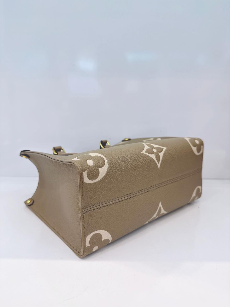 TOURTERELLE / CREAM MONOGRAM EMPREINTE LEATHER ONTHEGO PM HANDBAG